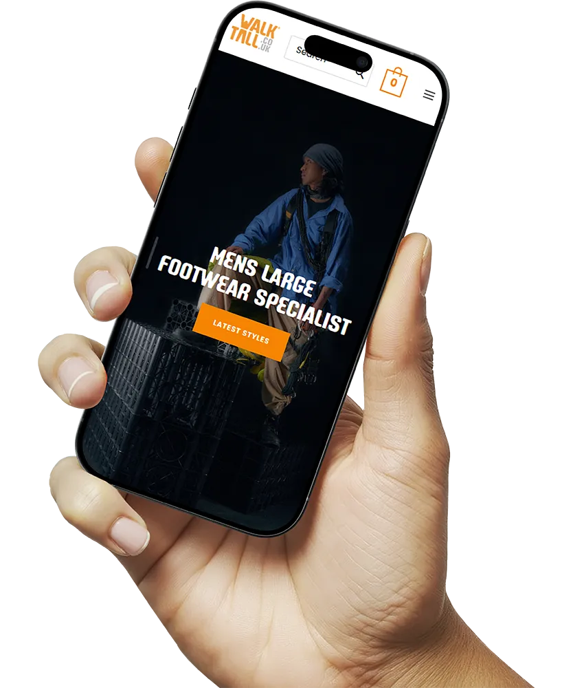 hand holding phone with website design on screen